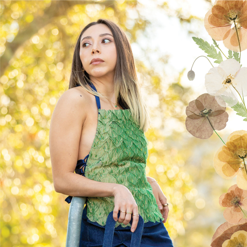 Student in green eco-fashion top poses on campus; floral collage accents the right side.