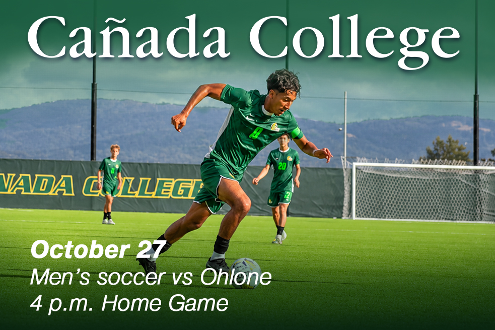 Soccer player running across a green field during a college match